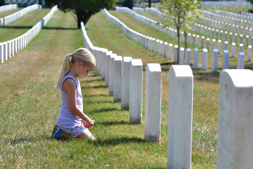Young girl praying in cemetery &#8211; pt