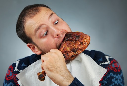 happy young man eating meat &#8211; pt