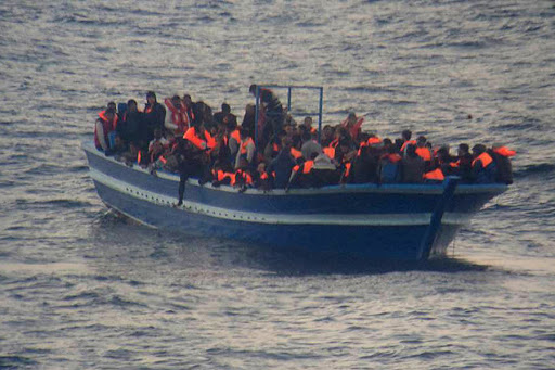 MEDITERRANEAN SEA &#8211; migrants standing on a boat &#8211; pt