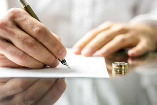A man signing divorce papers &#8211; pt