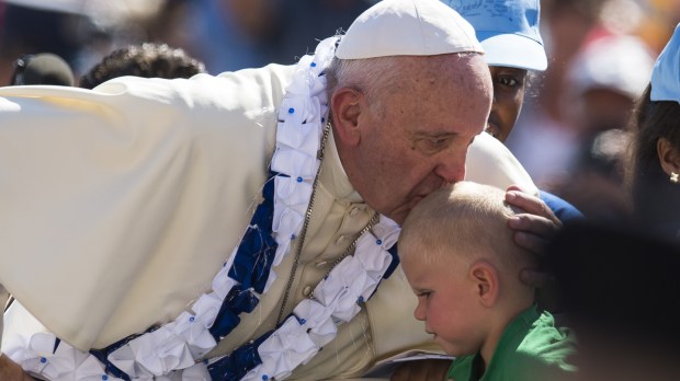 Pope Francis salutes a little baby