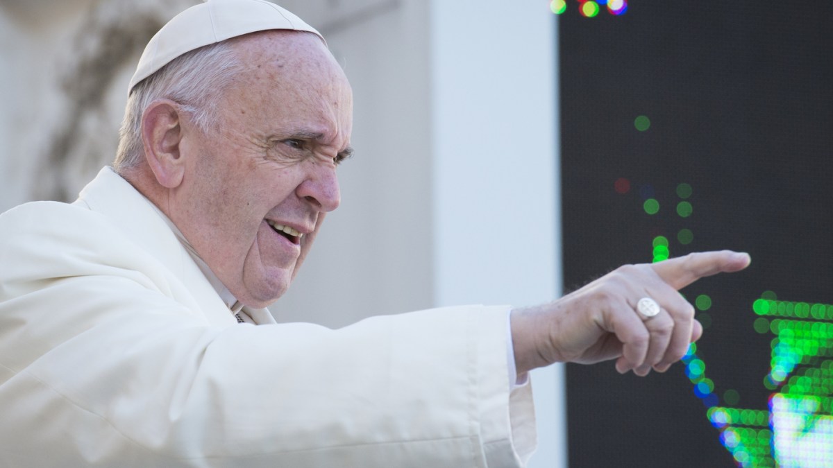 Pope Francis indicating with his finger someone