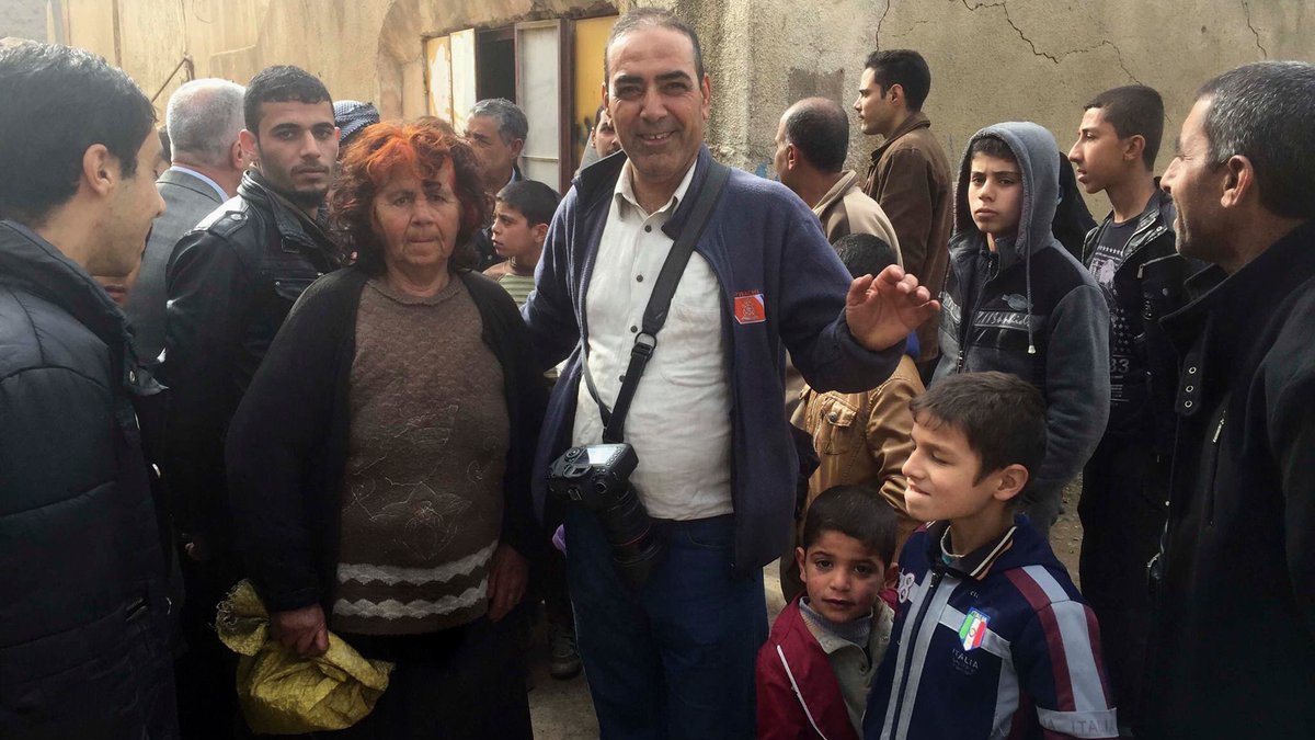 web-iraq-picture-of-christian-woman-with-ap-photographer-khalid-mohamed-after-a-muslim-family-hide-her-from-isis-in-mosul-since-2014