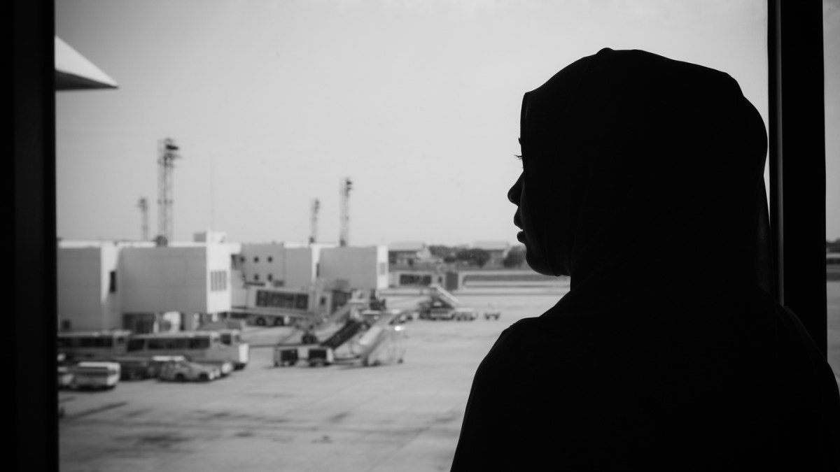 Muslim woman silhouette at the airport