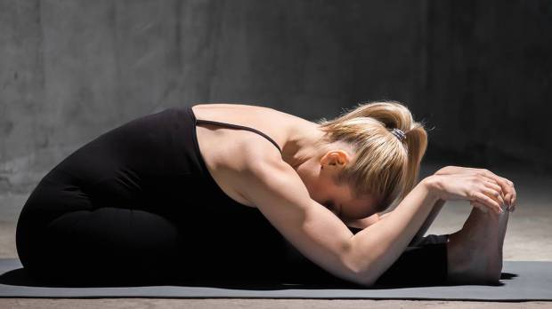 web-yoga-woman-dark-black-tights-blonde-fizkes-shutterstock_457691437