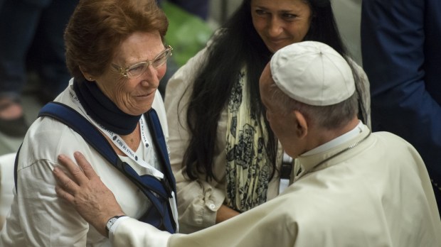 Pope Francis greets a woman
