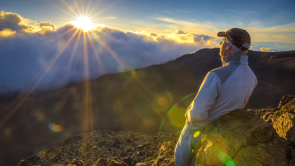 web-man-mountain-sunrise-clouds-lens-flare-dave-dugdale-cc