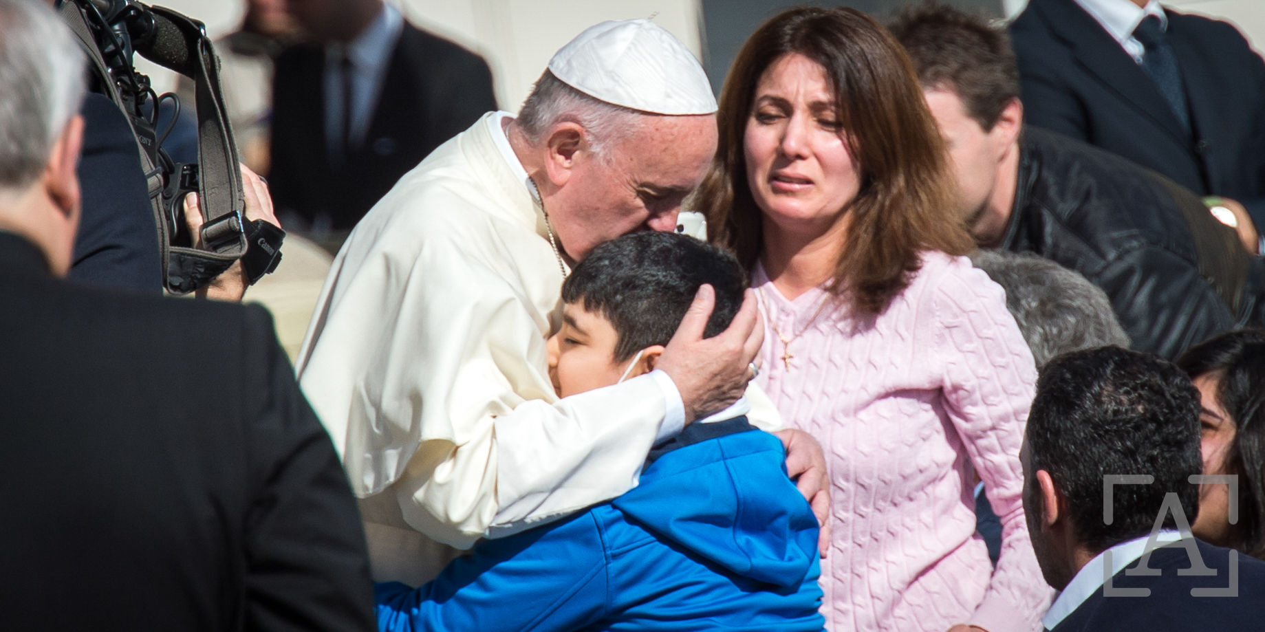 A sick Boy hug’s Pope Francis