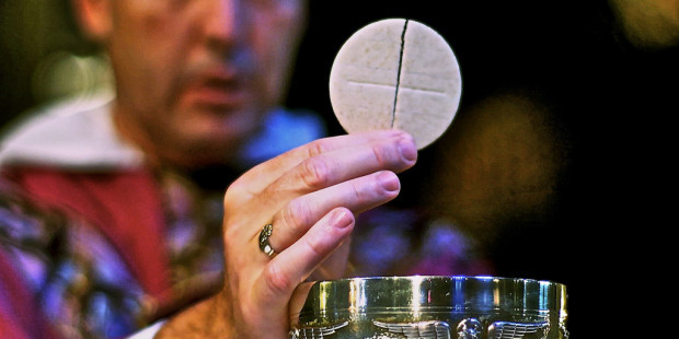 web3-eucharist-host-communion-priest-hand-closeup-st-joseph-cc