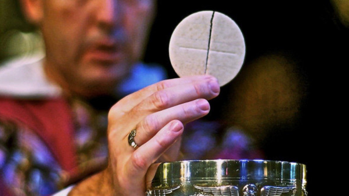 web3-eucharist-host-communion-priest-hand-closeup-st-joseph-cc