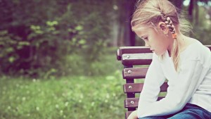 web3-little-girl-sad-bench-park-pigtails-child-shutterstock