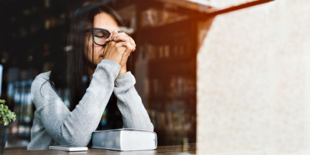 web3-woman-praying-cafe-coffee-shop-scripture-shutterstock