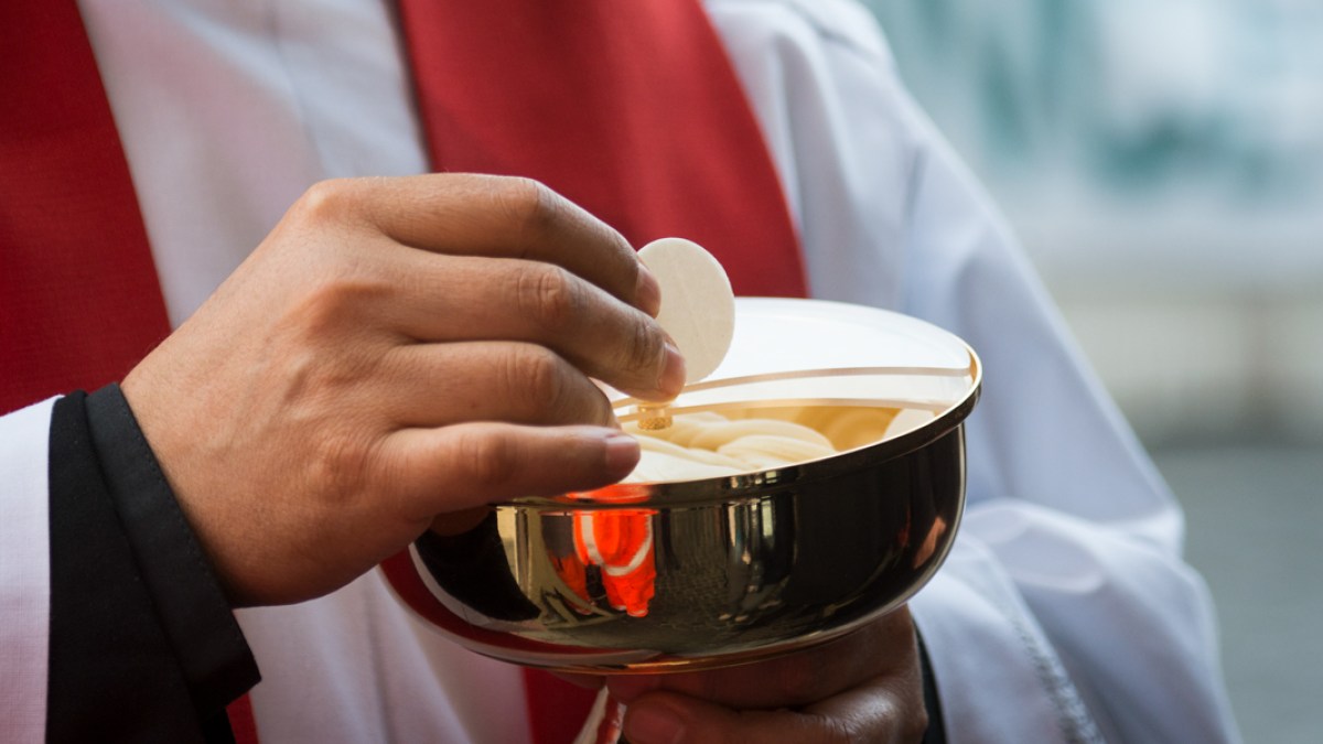 Holy Communion – Catholic priest