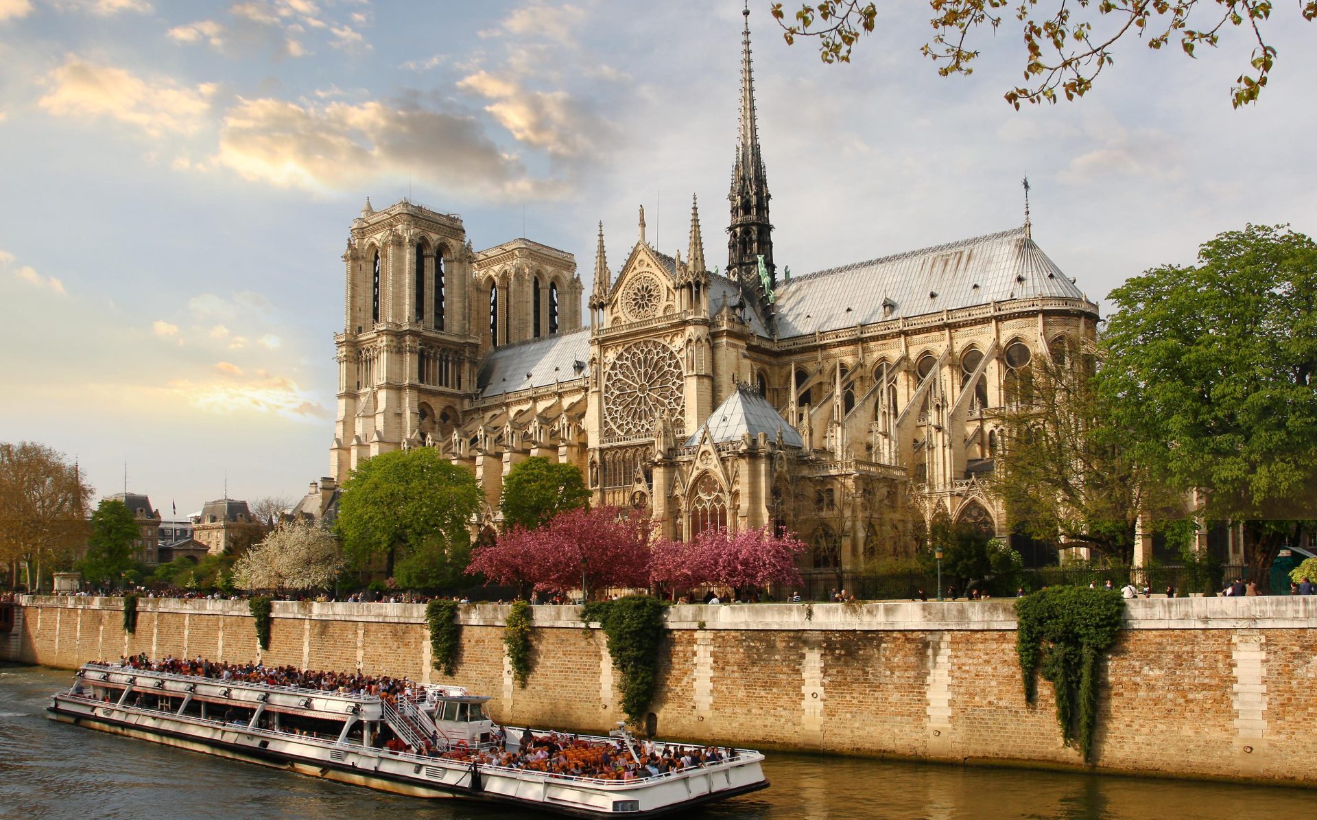 Notred_Dame_Paris_Boating_Past_Church_shutterstock_74901310