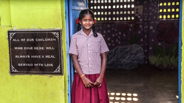 ORPHAN STANDING IN DOORWAY