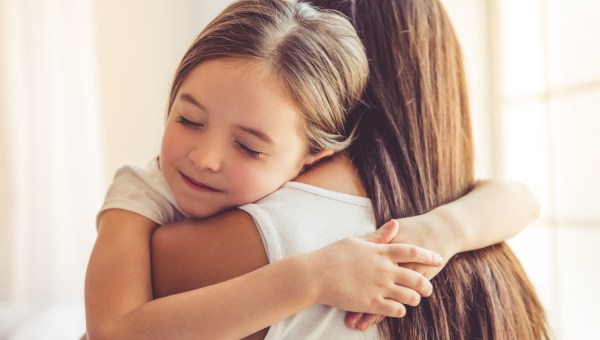 MUM AND KID HUGGING