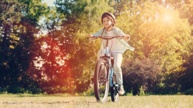 WEB3 BOY BIKE BICYCLE FREEDOM FUN FALL Shutterstock