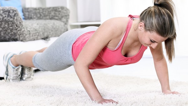 WOMAN EXERCISING