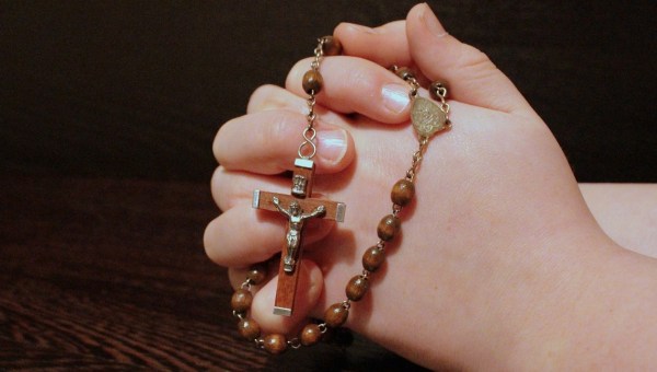 PRAYING ROSARY