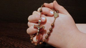 PRAYING ROSARY