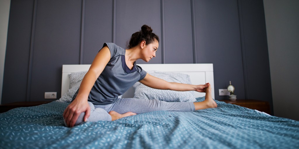 WOMAN,EXERCISE,BED