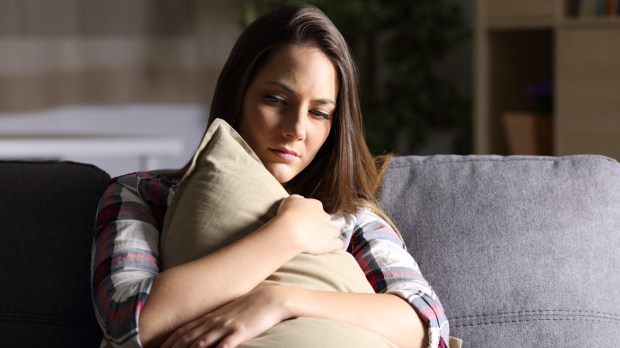 web3-woman-sad-sadness-depression-home-couch-living-room-shutterstock
