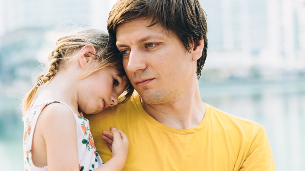 FATHER HOLDING DAUGHTER