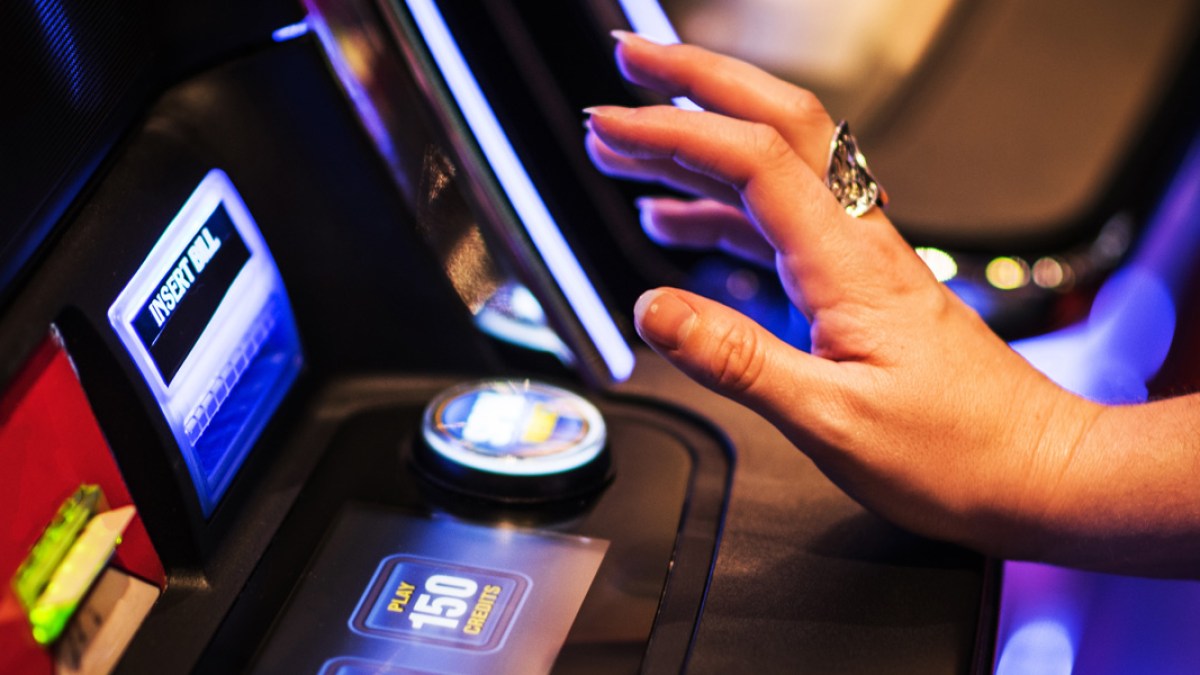 WOMAN,HAND,SLOT MACHINE