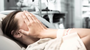 WOMAN IN HOSPITAL BED