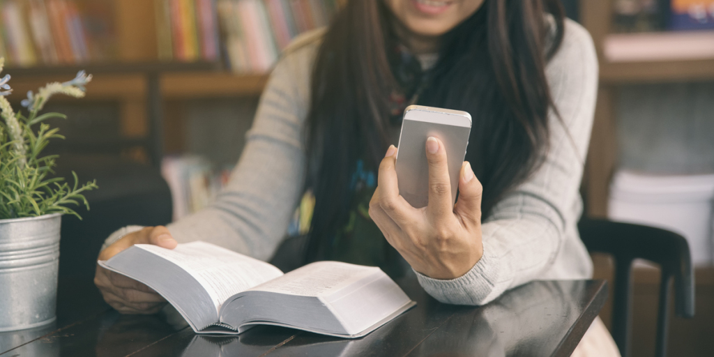 WOMAN LOOKING AT PHONE