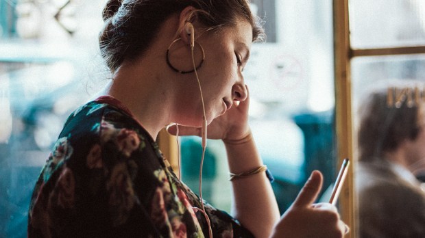 WOMAN LISTENING TO MUSIC