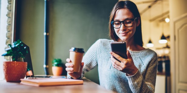 WOMAN READING NEWS