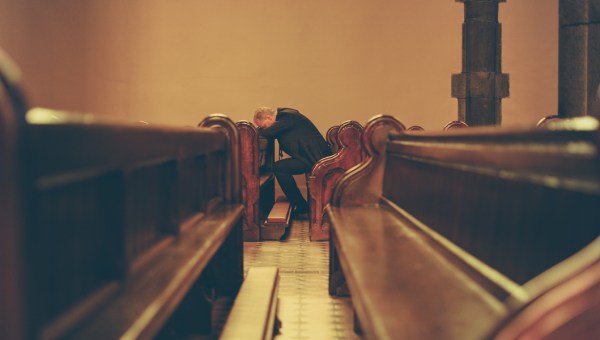 MAN,PRAYING,CHAPEL