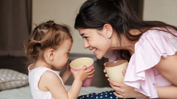 mother drinking tea with her daughter