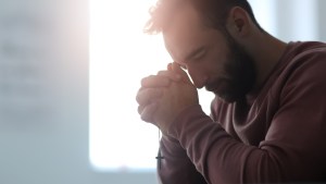 young man praying