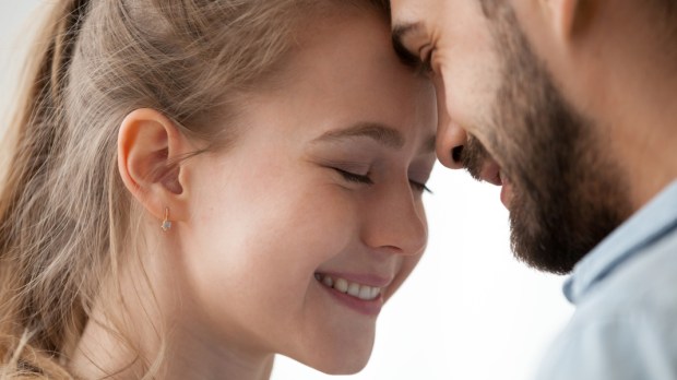 WEB2 -Close up of loving man and woman touching forehead having sweet tender moment together, happy millennial couple smile caressing each other, young husband and wife enjoy tenderness at home &#8211; shutterstock_1230899386.jpg