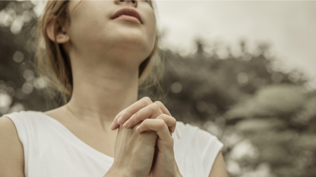 WOMAN, PRAYING,