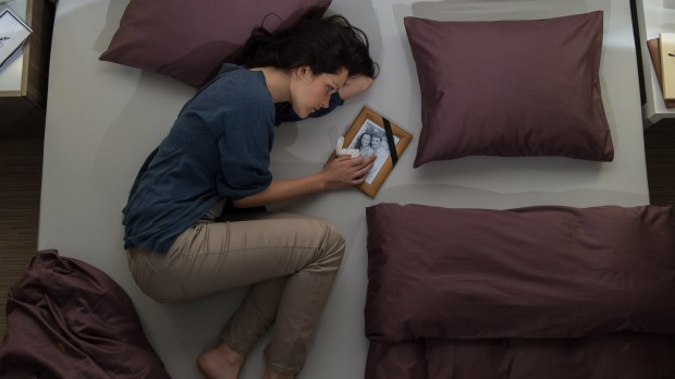 web-woman-mourn-mourning-bed-shutterstock_159284819-candybox-images-ai.jpg