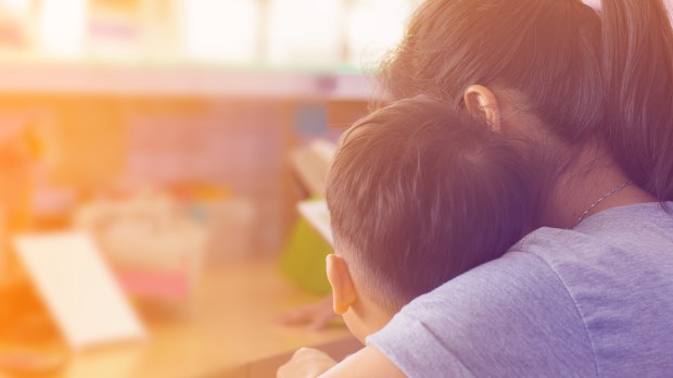 MOM HUGS SON,