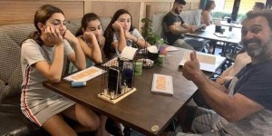 Imagem viral de família em restaurante é mistura de criatividade e tragédia