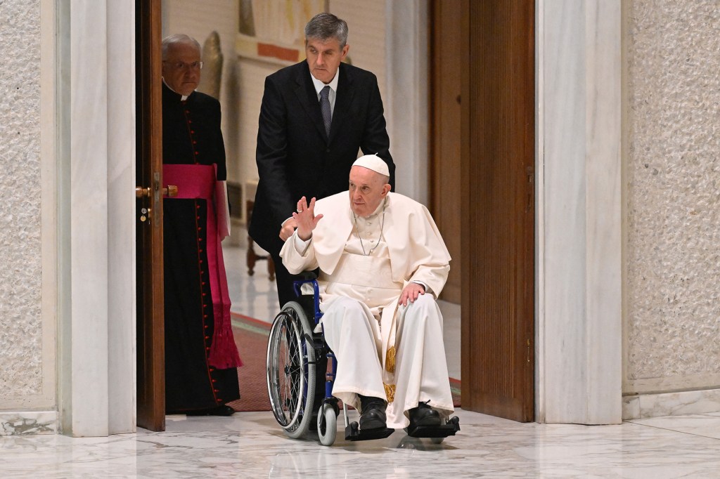 Pope Francis arrives on wheelchair