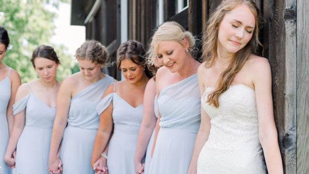BRIDAL PARTY PRAYING