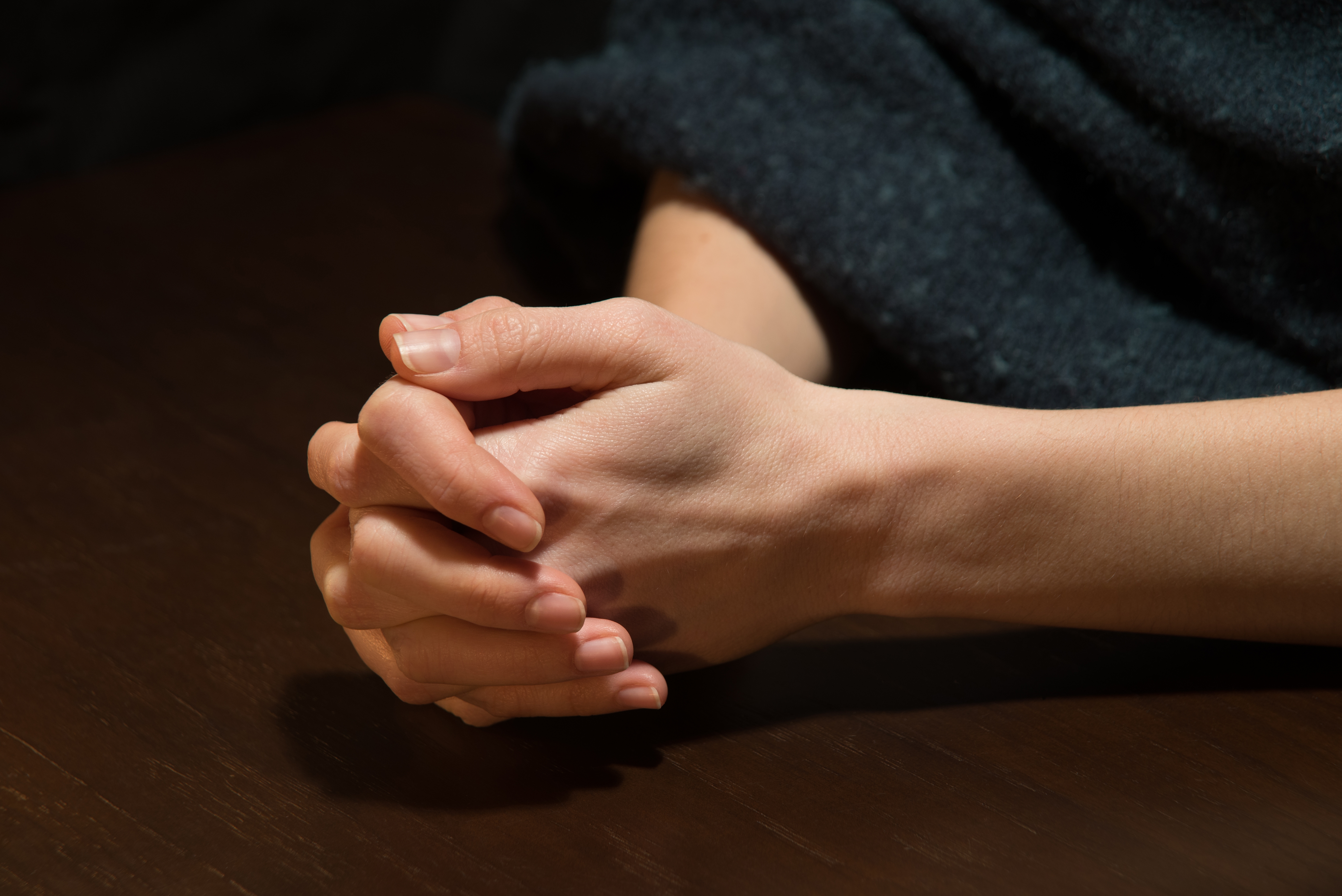 prayer-hands-woman-shutterstock_2188707231.jpg