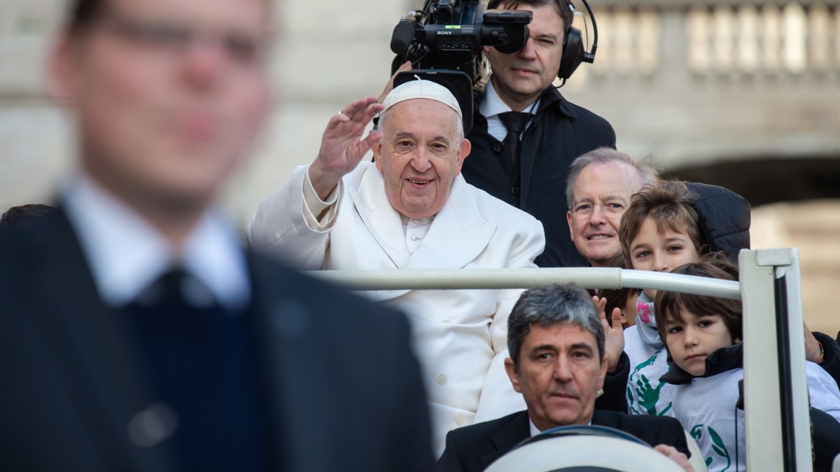 Pope Francis arrives on his popemobile with children to his weekly general audience