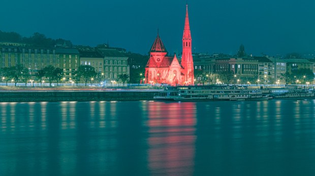 Red wednesday church lit up, Hungary