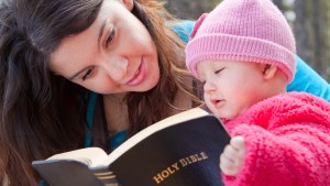 Baby and mom reading Bible