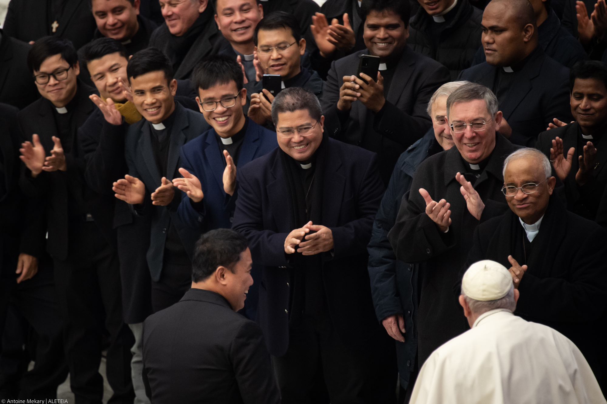 Pope Francis meets with priest at the end of his weekly general audience in Paul VI Hall