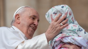 Pope Francis blesses a child