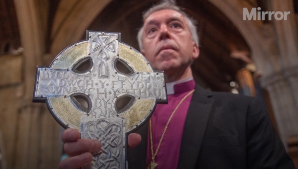Archbishop Andrew John of the Church in Wales, holding Cross of Wales