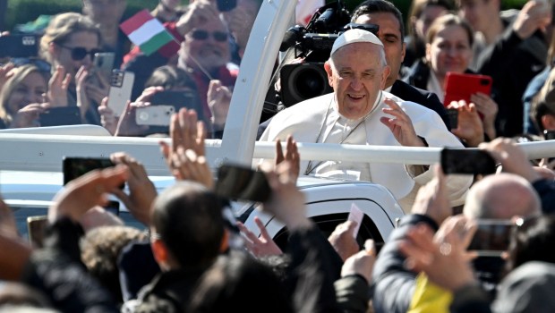 Pope Francis waves as he arrives to celebrate a holy mass at Kossuth Lajos' Square during his visit in Budapest